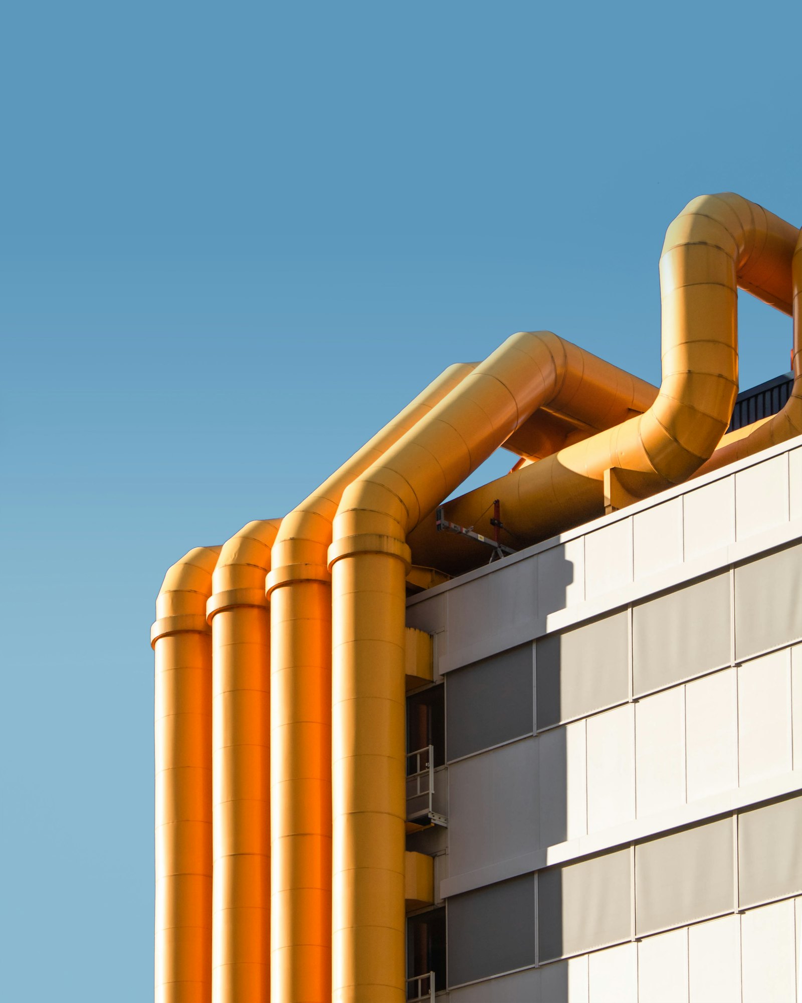Water-cooled chiller and piping inside a commercial mechanical room