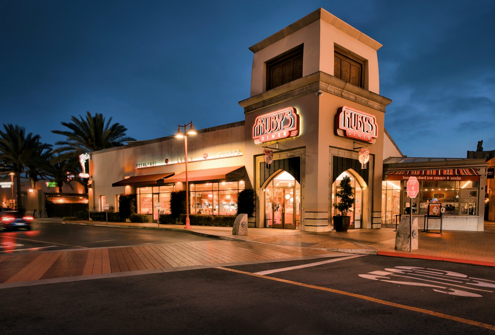 Rooftop unit fleet above a Dallas retail strip center with multiple tenant suites