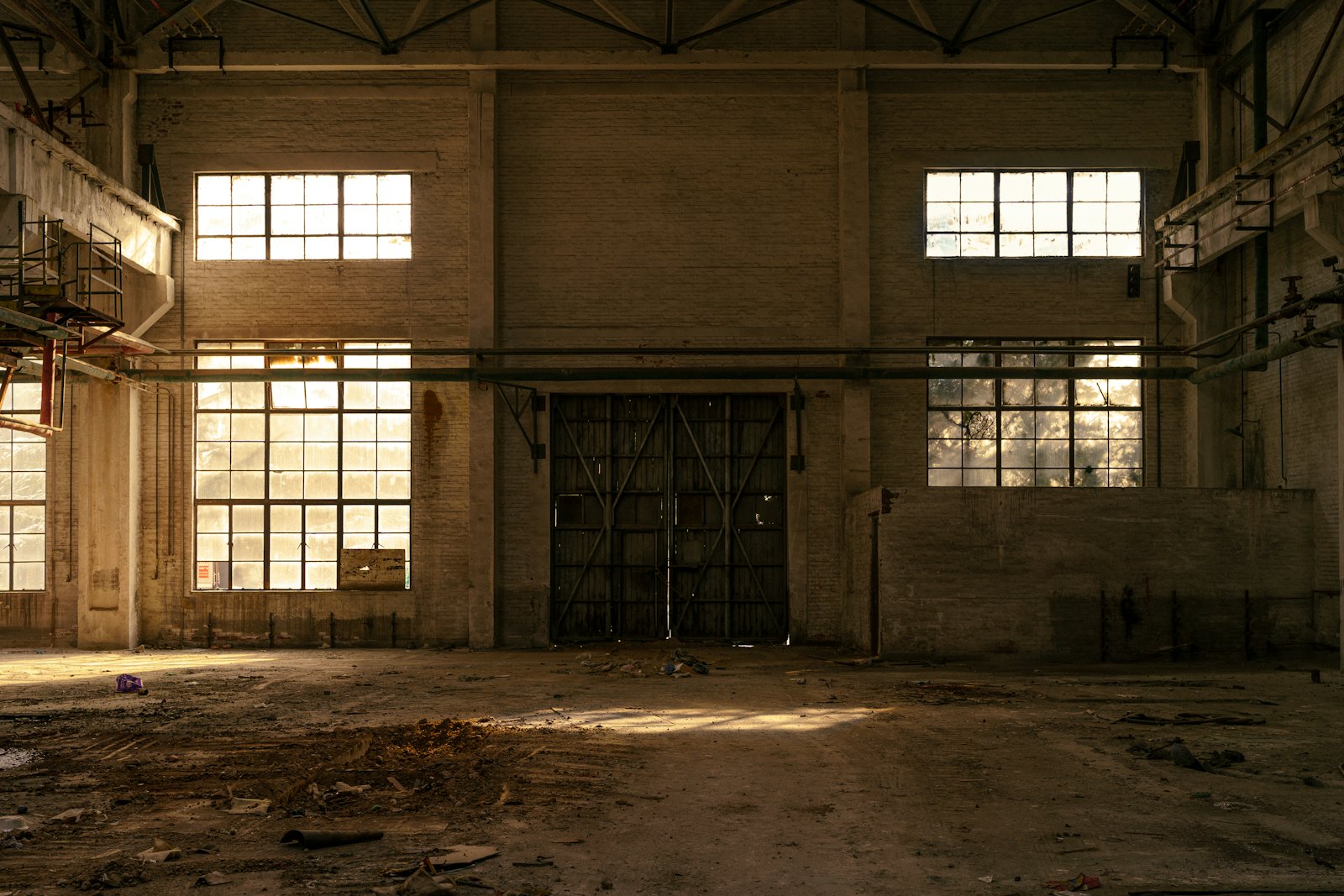 High-bay unit heaters and destratification fans inside a Dallas warehouse ceiling